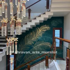 This double-height staircase wall was transformed with delicate, hand-laid gold foil feathers over a deep teal background. The way the metallic finish catches the light as you walk by creates a dynamic and luxurious experience, turning a simple wall into a statement piece.