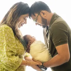 The quiet connection between new parents and their baby is pure magic. We use soft, natural light to create timeless, emotional portraits that you will cherish forever.