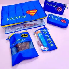 This personalized superhero-themed travel organizer set is perfect for keeping a child's belongings tidy on any trip. It includes clearly labeled pouches for clothes, medicine, and other essentials.