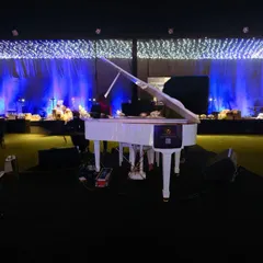 The centerpiece of this sangeet night was a magnificent white grand piano, which I placed on a central stage to set a tone of elegance and melody.