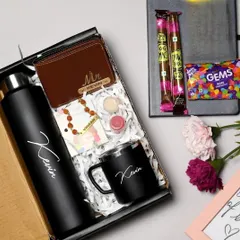 Spoil your brother with this premium Rakhi combo. It includes a personalized bottle and mug, a custom name wallet, a Rudraksha rakhi, and chocolates, all beautifully arranged in a gift box.