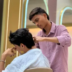 Finishing touches make all the difference. Here, we are cleaning up the neckline to ensure the haircut looks sharp and well-defined from every angle.