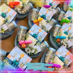 Celebrate a baby's first festival with our special milestone giveaways. This image shows a bulk order of 'First Holi' hampers, complete with colorful, baby-safe items designed to make the occasion joyful and memorable.