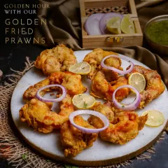 Golden hour with our Golden Fried Prawns. Crispy on the outside and juicy on the inside, these prawns are pure indulgence.