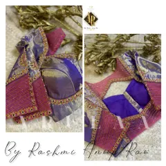 A unique blouse combining purple silk with a pink panel featuring linear embroidery. The design is finished with a delicate border of kundan work.