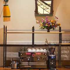 The day begins here, at our coffee station. A state-of-the-art La Marzocco machine, fresh flowers, and elegant decor set the tone for the quality and care we put into every part of your experience, starting with the perfect cup.
