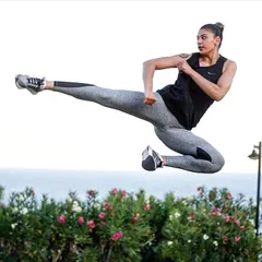 An explosive flying side kick, capturing the athleticism we cultivate in our advanced students. This move requires power, timing, and complete body control.