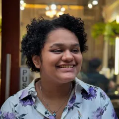 The wonderful "after". Look at that happy smile and those juicy, defined curls. This haircut and styling brought out her hair's natural pattern and gave it a manageable, fresh shape.