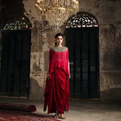 This is where modern drama meets timeless elegance. I love helping clients find showstopping pieces like this draped red gown with an embellished neckline, perfect for making an unforgettable entrance at a wedding reception or gala.