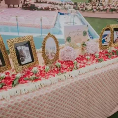 A "Generations of Love" table honoring the family's legacy. We displayed cherished family wedding photos in ornate golden frames, creating a beautiful tribute to the love that paved the way for the new couple.