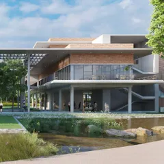 A view of the Mahindra University centre from across the natural water body it is planned along. The design integrates a waterfront edge as a recreational spill-out, blending the built and unbuilt environments.