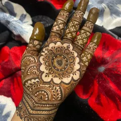 A perfectly symmetrical mandala is one of my favorite things to create. This design features a detailed floral mandala at the center, with intricate patterns on the fingers, leaving some negative space to make the artwork pop.