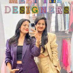 Meet the designers! That's me, Virashree, and my partner, Kesha. We're the women behind the brand, here to help you own your moment without owning the outfit.