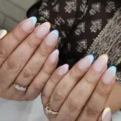 Perfect for summer, this pastel French manicure features a different soft color on each tip. It's a playful yet subtle way to incorporate color into a classic style.