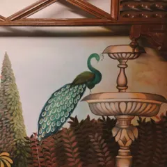 A close-up of the Mughal-style mural for a fine-dining restaurant, featuring a majestic peacock by a fountain. I love bringing such regal and vintage elegance to commercial spaces.
