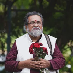 My Appa, Vidwan H S Venugopal, holding roses from his students. He always says he is a 'senior student of music', and that humility and lifelong dedication to learning is the greatest lesson he has taught me.