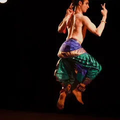 The athleticism of Kuchipudi in a single, frozen moment. This mid-air pose from the Samarpan festival showcases the demanding physical technique that underpins the expressive storytelling of the art form.