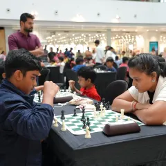 The beauty of chess is its universal appeal. This moment captures the intense concentration between two players from different generations during one of our open category competitions.