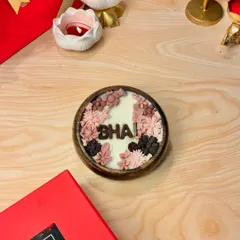 My "Bhai" candle from the Rakhi collection, featuring a masculine floral design in a wooden bowl. It's a thoughtful and unique gift for your brother.