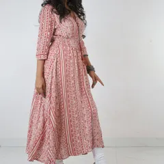 A three-quarter view is crucial for showing how a garment drapes and moves. This photo captures the A-line flare of the kurti, giving customers a better understanding of its shape and volume, which is difficult to convey in a simple flat-lay.