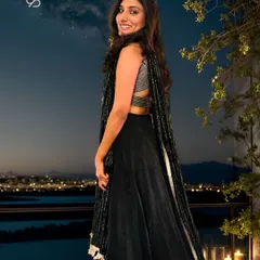 Radiating elegance and grace, my client is adorned in a bespoke black lehenga embellished with delicate cut dana and zari work, stealing the spotlight at an enchanting sangeet celebration.