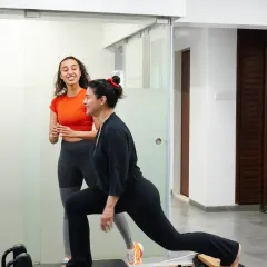 A smile during a tough workout is a sign of a great session. Our founder Namrata Purohit guides Kajol through a reformer exercise, ensuring perfect form while keeping the atmosphere positive and motivating.
