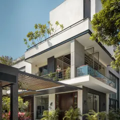 For Twin Villa, a home for two families, we designed a structure that balances privacy with connection. The architecture uses layered volumes, deep balconies, and integrated planters to create a modern residence that is softened by the landscape it inhabits.