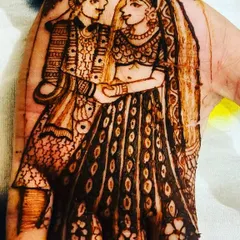Your love story, drawn on your hands. I specialize in creating detailed portraits like this one, capturing the bride and groom in henna as a beautiful, personal keepsake of their special day.