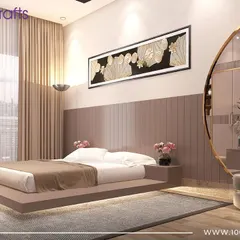 A bedroom from our 'Sobha Daisy' project, featuring a unique floating bed with under-lighting. The dusty rose color palette and large circular mirror create a soft, glamorous, and modern aesthetic.