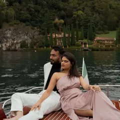 A chic portrait of Nisarg and Mansi on a classic wooden boat in Lake Como, Italy. This image combines luxury, style, and the stunning natural scenery of the Italian lakes for a truly aspirational pre-wedding shot.