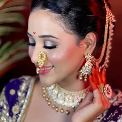 This side profile captures the beautiful contouring and the detailed eye makeup. Learning to create a look that is perfect from every angle is a key part of my training.