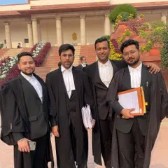 With my colleagues at the Supreme Court, ready for the day's proceedings. Our team ensures we are always prepared for every legal battle.