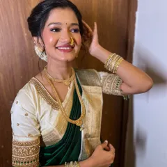 A happy and radiant bride-to-be. Her smile lights up the frame, and her soft glam makeup enhances her natural beauty.