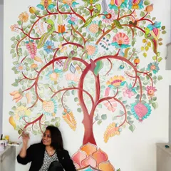 Here I am with a completed Kalamkari 'Tree of Life' mural, a piece that connects deeply with our Indian artistic roots. This style is perfect for adding a meaningful and vibrant story to a large feature wall in a home.