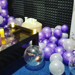 A view of the floor space, which we often fill with balloons for celebrations. The room is designed to be flexible for both movie watching and partying.