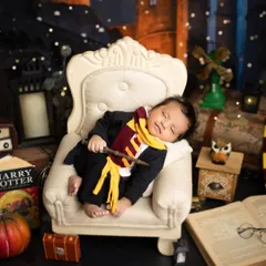 Even the most powerful wizards need their nap time. This shot captures the peaceful side of our Harry Potter theme, focusing on the baby's serene expression.