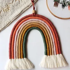 This large, earthy-toned rainbow hanging is one of my favorite custom pieces. The warm, muted colors are perfect for creating a calm and cozy atmosphere in any room.