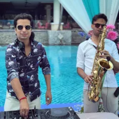 Elevating a poolside party in Hua Hin, Thailand by teaming up with a live saxophonist. This fusion of DJ beats and live instruments adds a layer of sophistication and creates a unique performance.