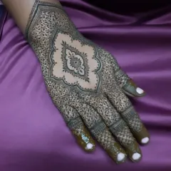 The completed design, with the central motif surrounded by incredibly fine, detailed filler work.