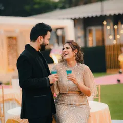 Capturing genuine laughter and joy. This photo of the couple sharing a lighthearted moment at their reception is full of happiness.