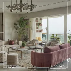 A closer look at this stylish haven, where modern aesthetics meet comfortable seating. The room features a mix of plush sofas, unique accent chairs, and lush greenery, creating a perfect setting for gatherings.