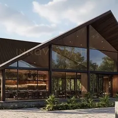 The rendered vision for The Bliss Banquet & Resort, a modern glass house designed for grand celebrations. The A-frame structure with floor-to-ceiling glass walls blurs the line between indoors and outdoors, creating an immersive experience within its natural surroundings. This project showcases our capability in large-scale hospitality architecture.