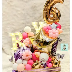 I had so much fun working on this birthday hamper for Yash and Roohi Johar's 6th birthday. It’s filled with amazing gifts and decorated with personalized balloons and marquee lights.