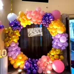 A closer look at the multi-colored balloon arrangement, showing the texture and mix of sizes that create a full, organic feel. This setup is perfect for making a statement in any room.