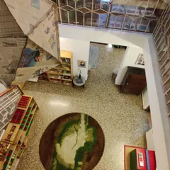 An overhead view of our learning space, showing the orderly arrangement of materials and work areas. This sense of order in the environment helps develop a sense of order in the mind.