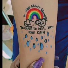 A beautiful and motivational rainbow tattoo. Our artists can create custom designs with text and images, all with kid-safe, non-toxic paint.
