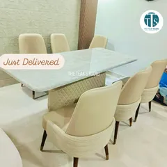 Just delivered to a happy client, this six-seater dining set features a light marble top and a unique quilted upholstered base. The neutral tones of the chairs and table create a calm, elegant, and cohesive dining space.