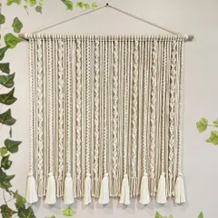 I designed this piece as a beautiful backdrop or curtain. The repeating spiral knots and tassels create a simple yet elegant pattern that adds a soft, boho touch to any space.