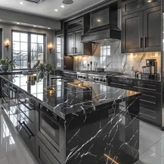 I design luxurious kitchens that are both beautiful and highly functional. This black marble island kitchen features high-gloss cabinetry, integrated appliances, and dramatic lighting to create a statement space for cooking and entertaining.