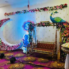 Creating a magical dreamscape for your baby shower is my passion. This setup combines a beautiful floral crescent moon with a traditional swing and a majestic peacock, all set against an elegant backdrop to make your celebration unforgettable. 💖